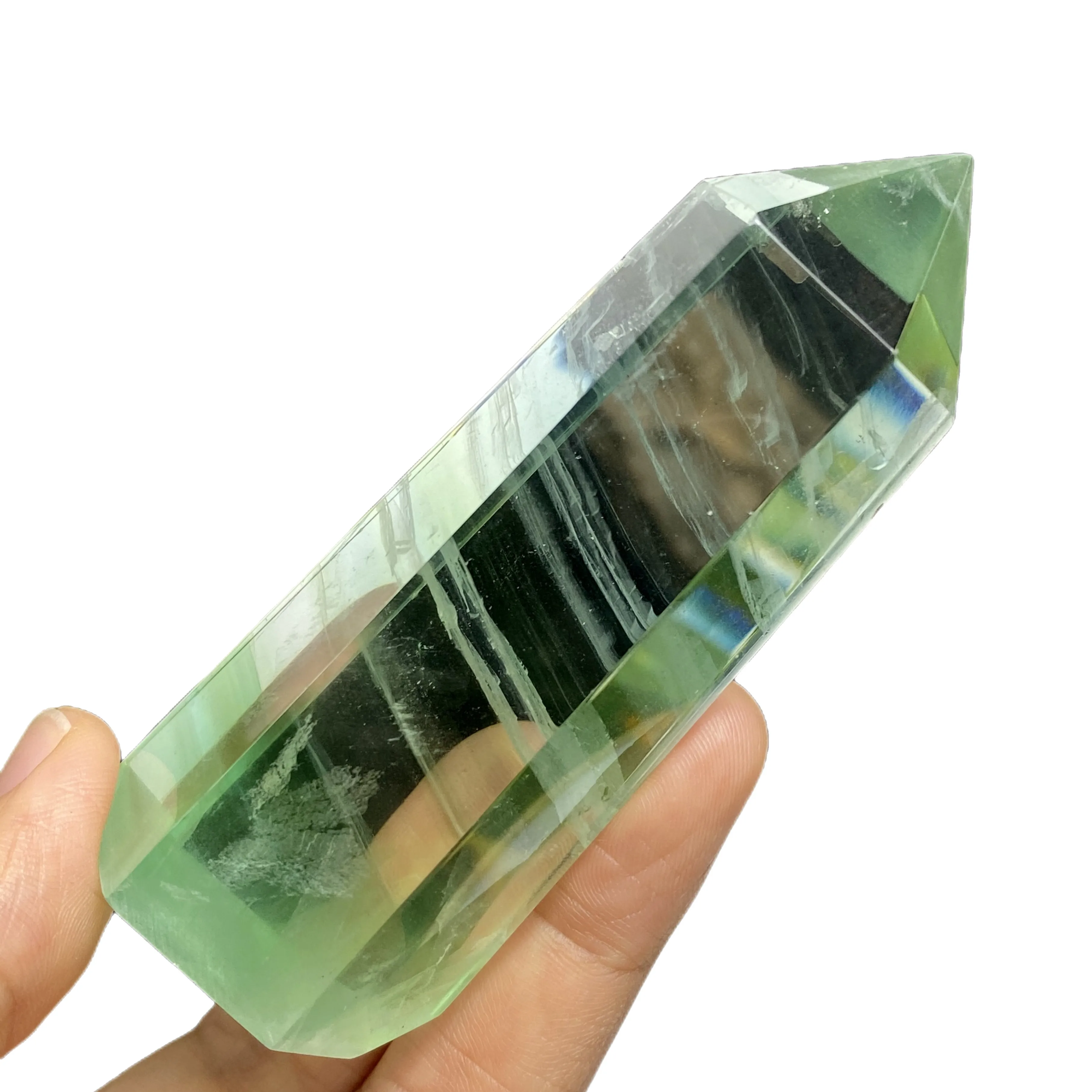 Dabas caurspīdīga zaļa fluorite kolonnas kristāls ar varavīksnes vienu norādīja sešstūra prizmu, neapstrādāta akmens pulēšanas piederumi